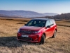 Land rover discovery sport restyle in field with blue sky on background